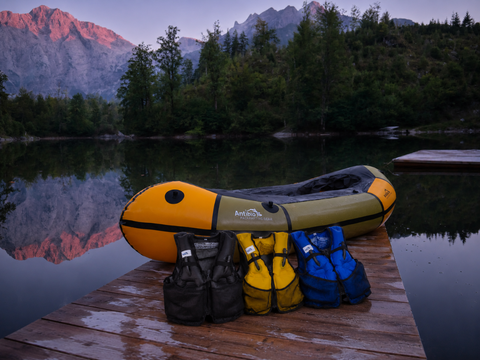Picture of vests leaning to a packraft rebel 2k in a beutiful scenary